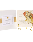 Decorative calendar with angel illustration and gold stand on a white background