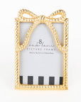 Gold bow-shaped picture frame with '8 Oak lane' branding on a white background