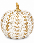 A decorative faux pumpkin with a textured white surface covered in tiny gold dots, featuring vertical gold leafy vine patterns and a metallic gold stem, set against a plain white background.