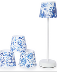 Set of blue and white floral-patterned lamps on a white background