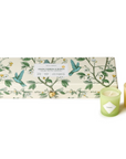 A set of five candles with a floral pattern in a gift box, with the box displaying the fragrance names and candle colors.
