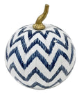 A decorative pumpkin with a white body, a navy blue chevron pattern, and a metallic gold stem, shown against a plain white background.