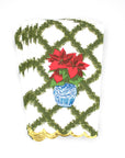 A pack of paper guest towels with a poinsettias design, featuring green and red colors and gold scalloped edges.