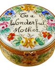 A round, porcelain Limoges box with floral patterns and the text 'To a Wonderful Mother' on the lid.