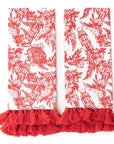 Red and white patterned scarf with tassels on a white background