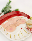 Santa serving platter showing candy canes, cookies and greenery