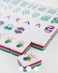 Colorful Mahjong tiles with various symbols on a white background
