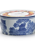 Ceramic container with blue floral design on a white background