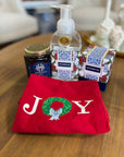 Joy towel, jar of honey, hand soap and candle bundle.