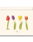 A notecard with a multicolored tulip design and the word 'Tulips' written at the bottom, accompanied by a beige envelope.
