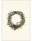 A notecard featuring a Christmas winter wreath design with green pine branches, red berries, and white snowflakes on a light background, accompanied by a matching envelope.