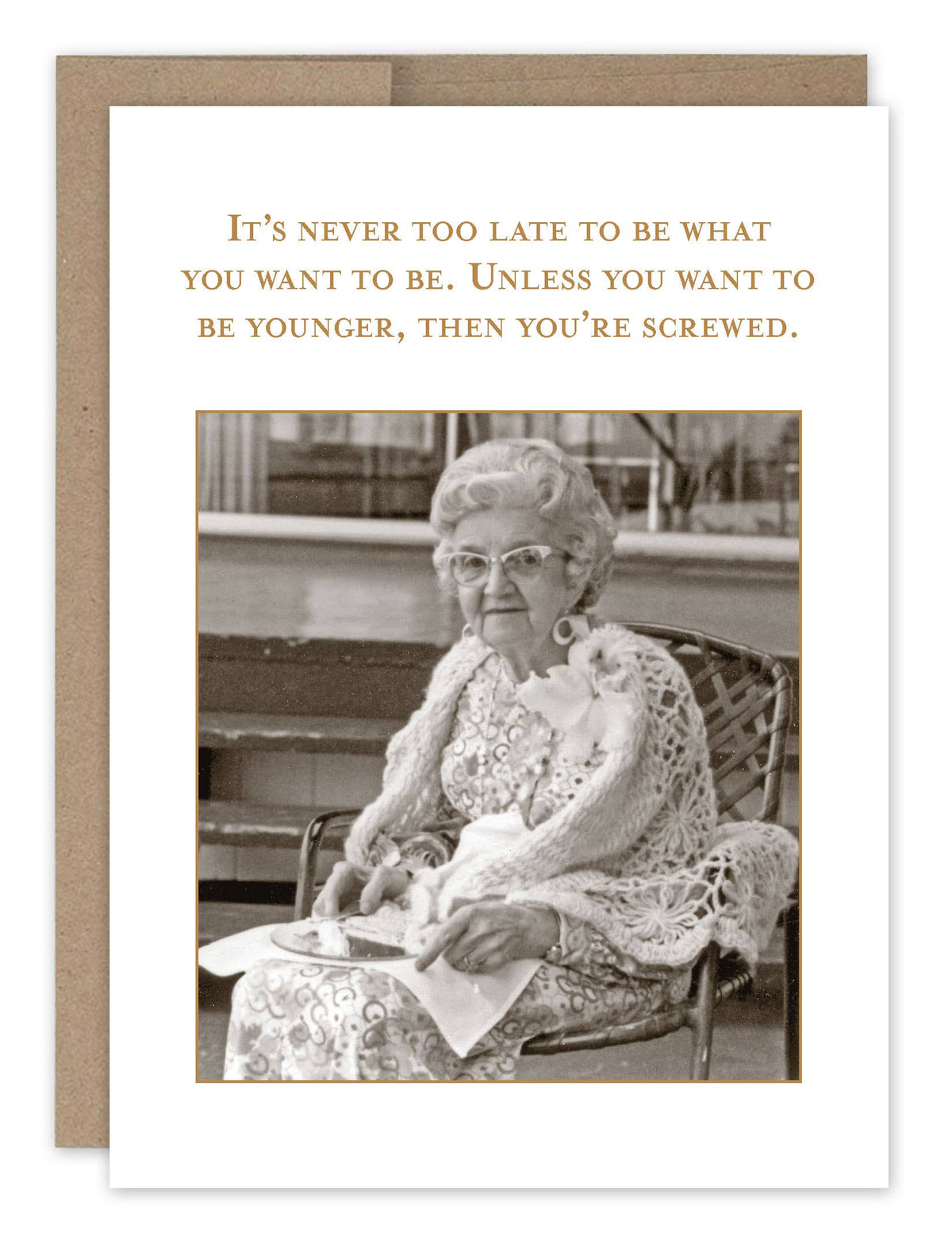 A birthday card featuring a vintage photo of an older woman with text above her image. The card is set against a white background and includes a brown envelope.
