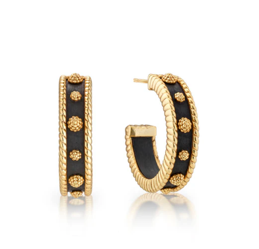 A pair of Berry Medium Hoop Earrings in ebony color with gold accents and a textured surface.