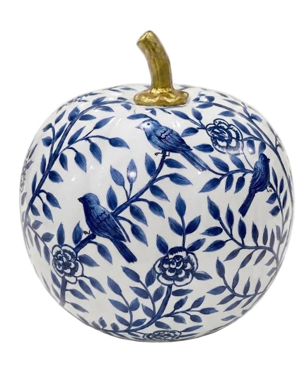 A decorative ceramic pumpkin with a white glaze, decorated with a blue floral and bird pattern, and featuring a metallic gold stem on a plain white background.