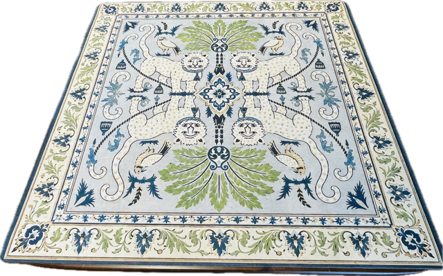 An ornate Mahjong mat with a detailed botanical and animal motif, featuring a light blue field, cream borders, green leaves, and blue accents.