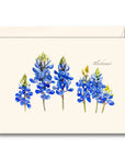 A notecard with a bluebonnet flower design and the word 'Bluebonnet' written at the bottom, accompanied by a white envelope.