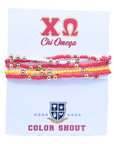 Set of red and yellow beaded bracelets on a card with Chi Omega logo