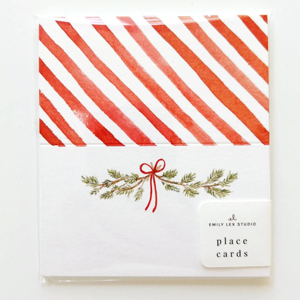 Place card with pine bough and red ribbon