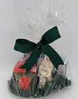 Candle, nutcracker ornament, kitchen linen and cocktail napkins all wrapped up in a bow and ready to give. 