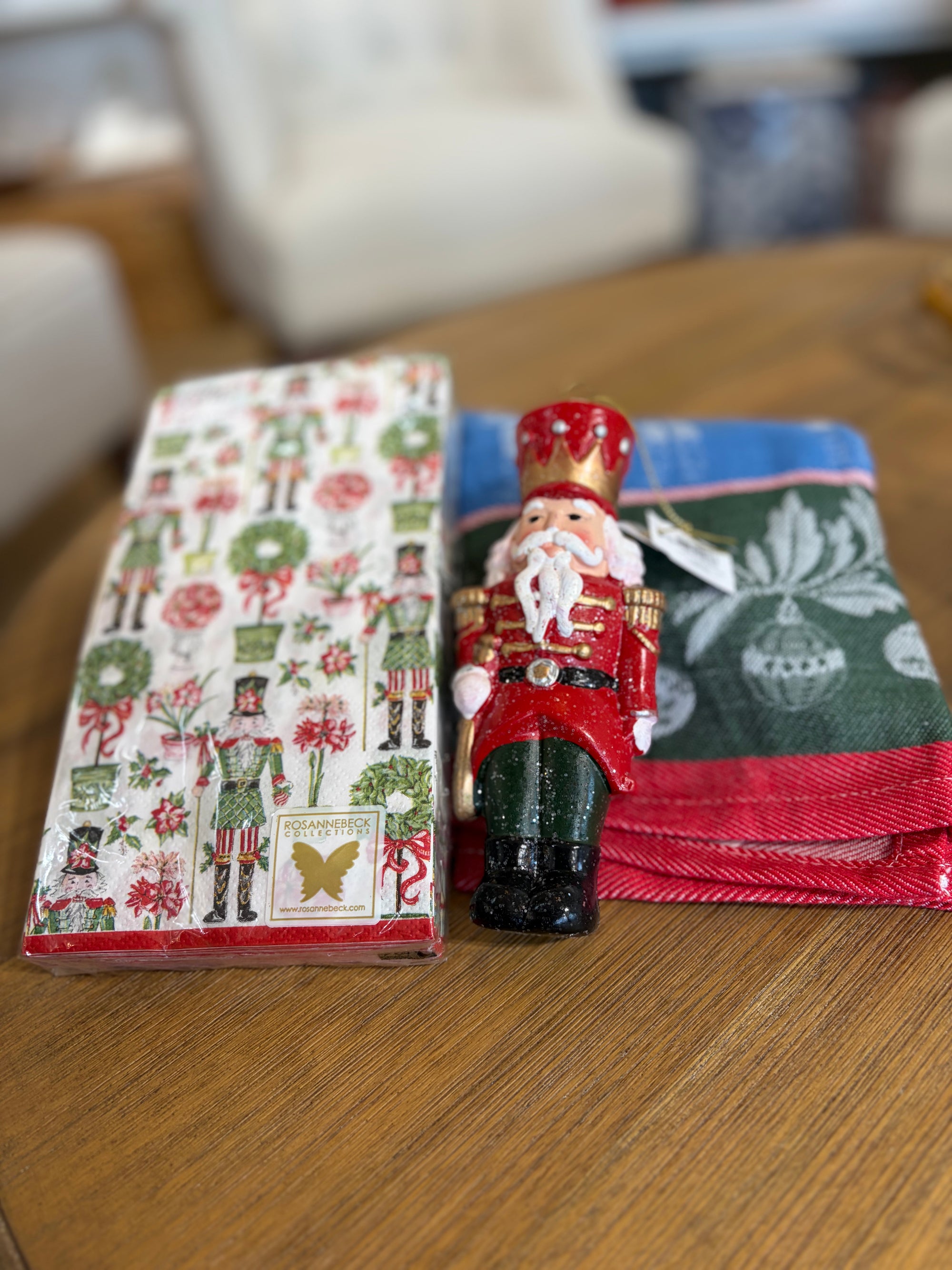Nutcracker ornament, nutcracker cocktail napkins and a Christmas towel.