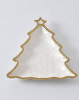 White Christmas tree-shaped dish with gold trim on a light gray background