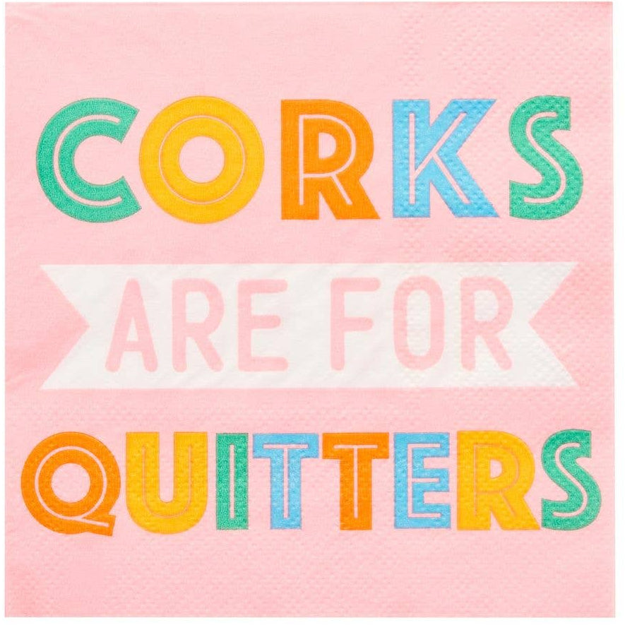 Pink cocktail napkin with colorful text 'Corks are for Quitters' on a white background
