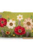 Green handbag with floral embroidery on a white background