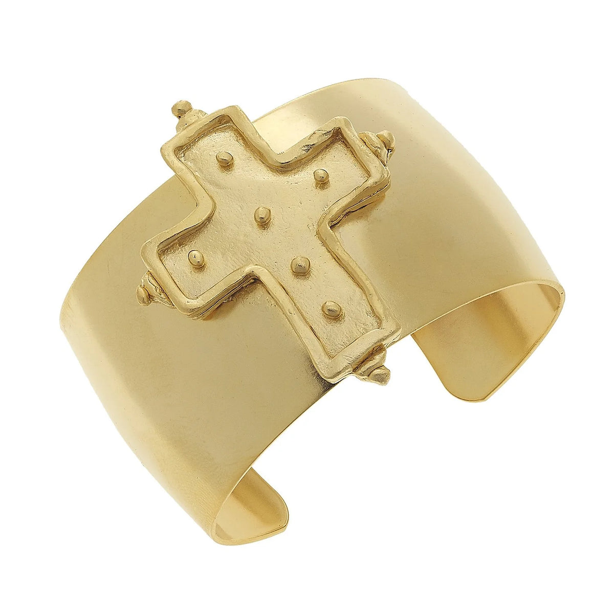 Gold cross on a gold cuff bracelet.