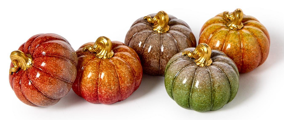 Five decorative ceramic pumpkins in assorted autumn colors including orange, red, brown, green, and yellow, each with a glossy finish and a metallic gold stem, arranged on a plain white background.