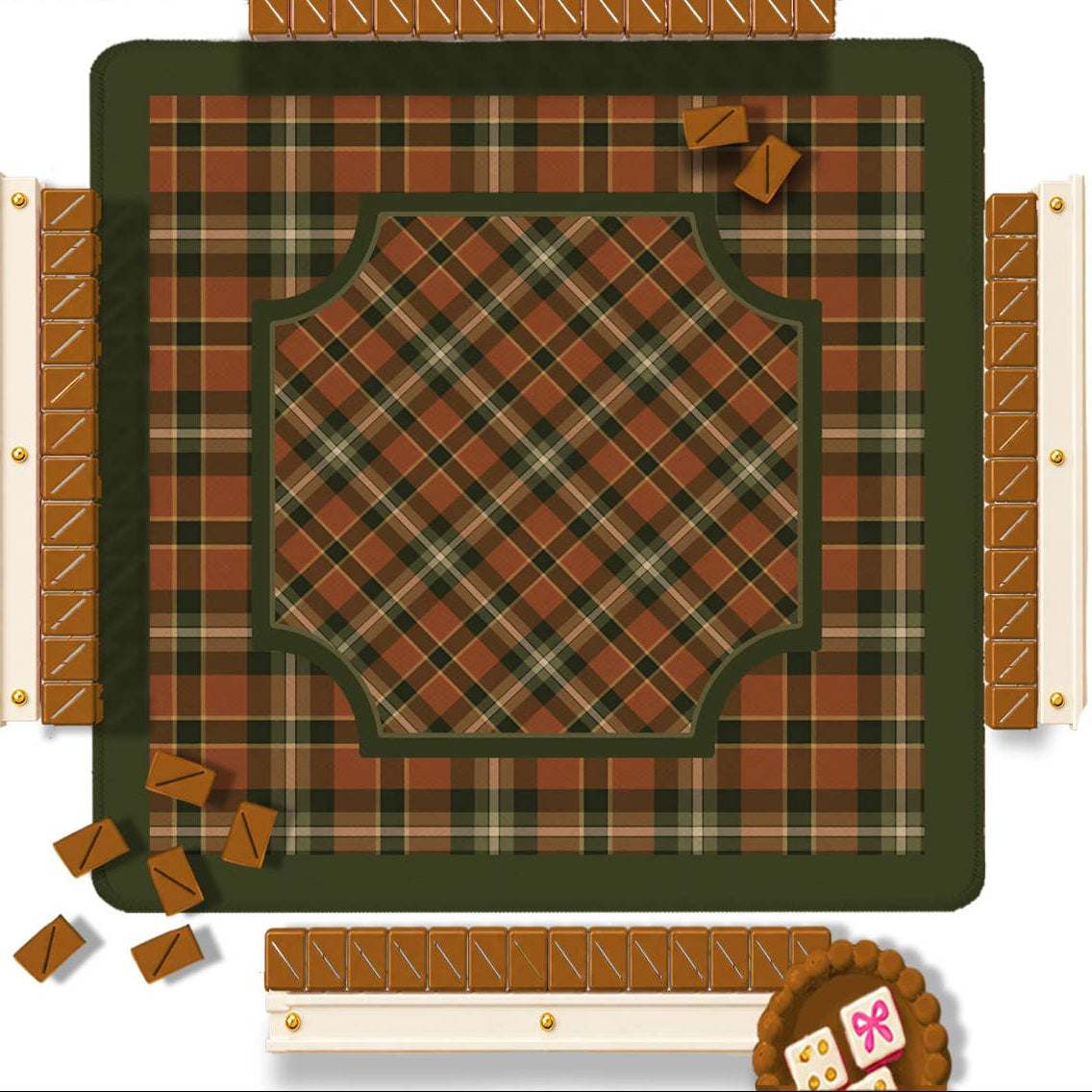 A top-down view of a plaid Mahjong mat with a few small game pieces scattered around it. The mat features a rust brown, olive green, and beige tartan pattern.