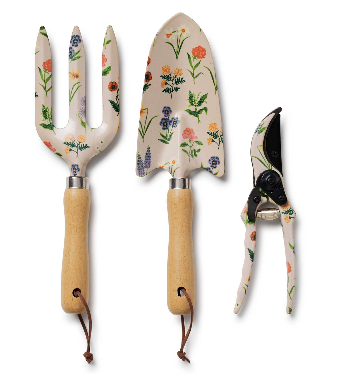 Set of three garden tools with floral handles on a white background