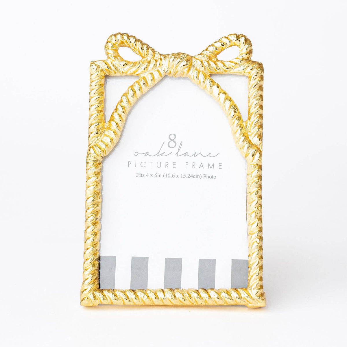 Gold picture frame with bow design on a white background
