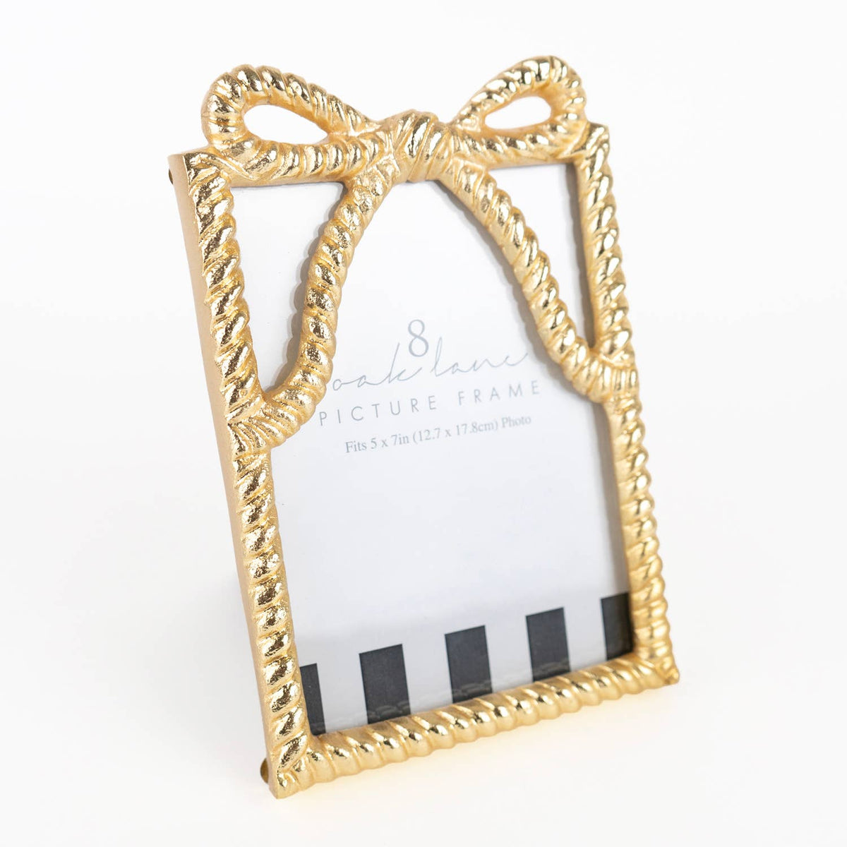 Gold bow-shaped picture frame on a white background
