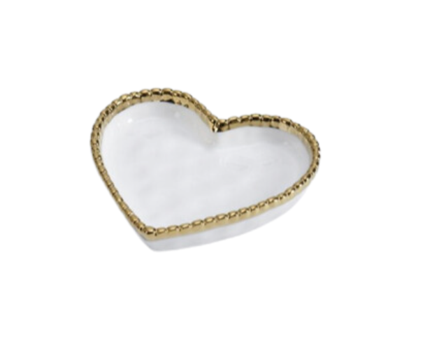 A gold and white heart-shaped dish with a mirrored interior.
