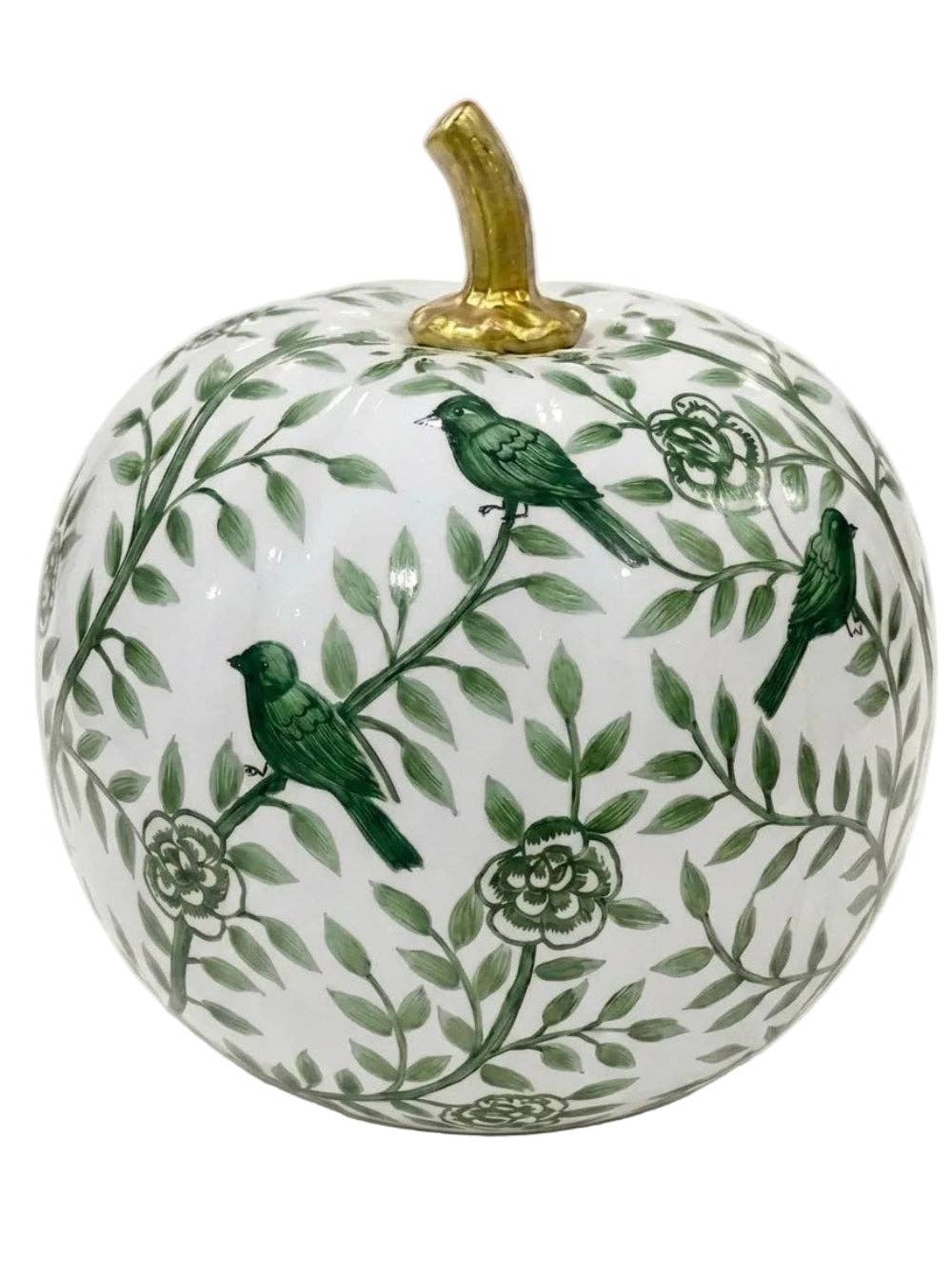 A decorative ceramic pumpkin with a white glaze, featuring a green botanical pattern of leaves, flowers, and three green birds, topped with a metallic gold stem.