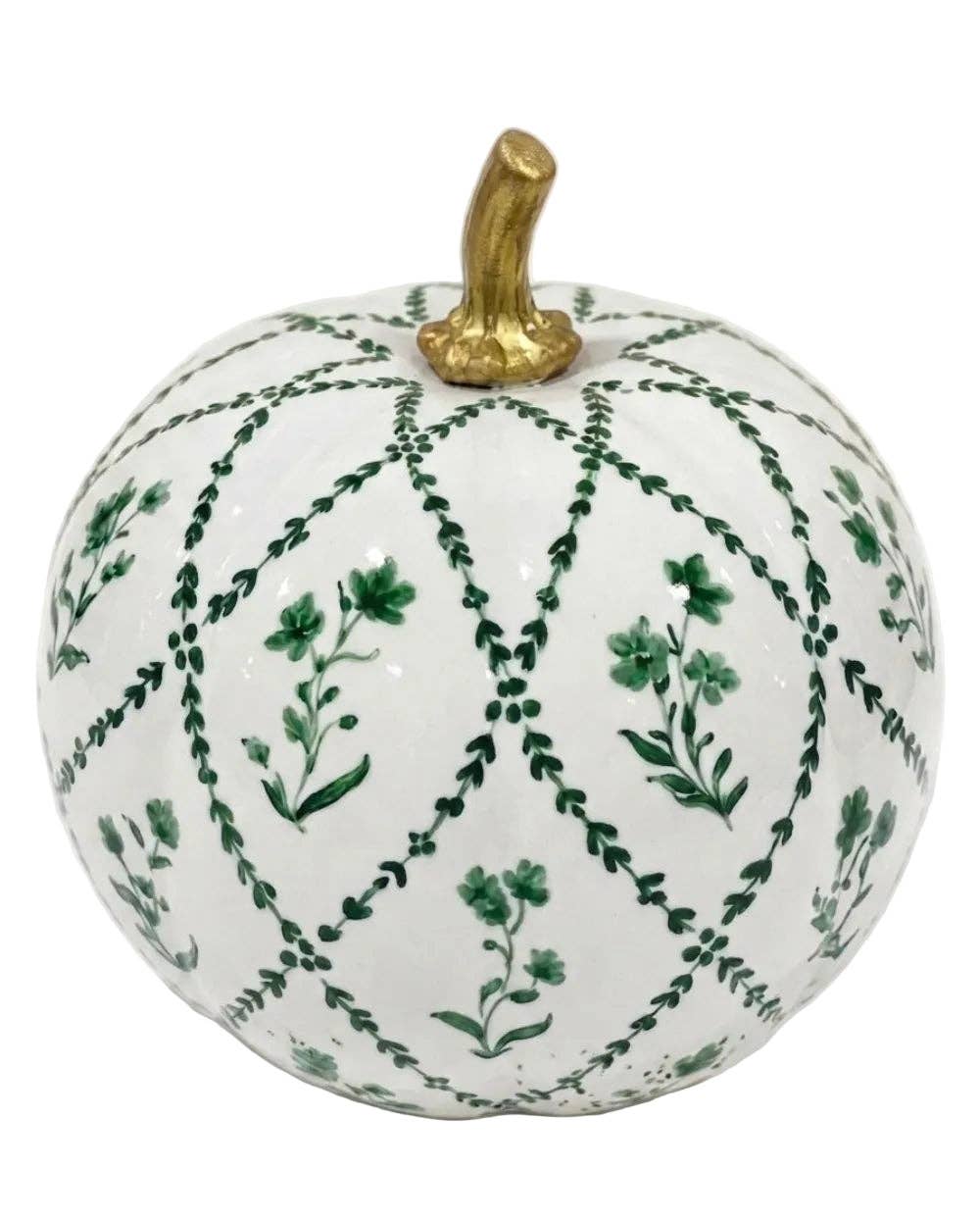 A decorative ceramic pumpkin with a white glaze, featuring a green vine and leaf pattern forming a lattice design, and a textured gold stem on a plain white background.