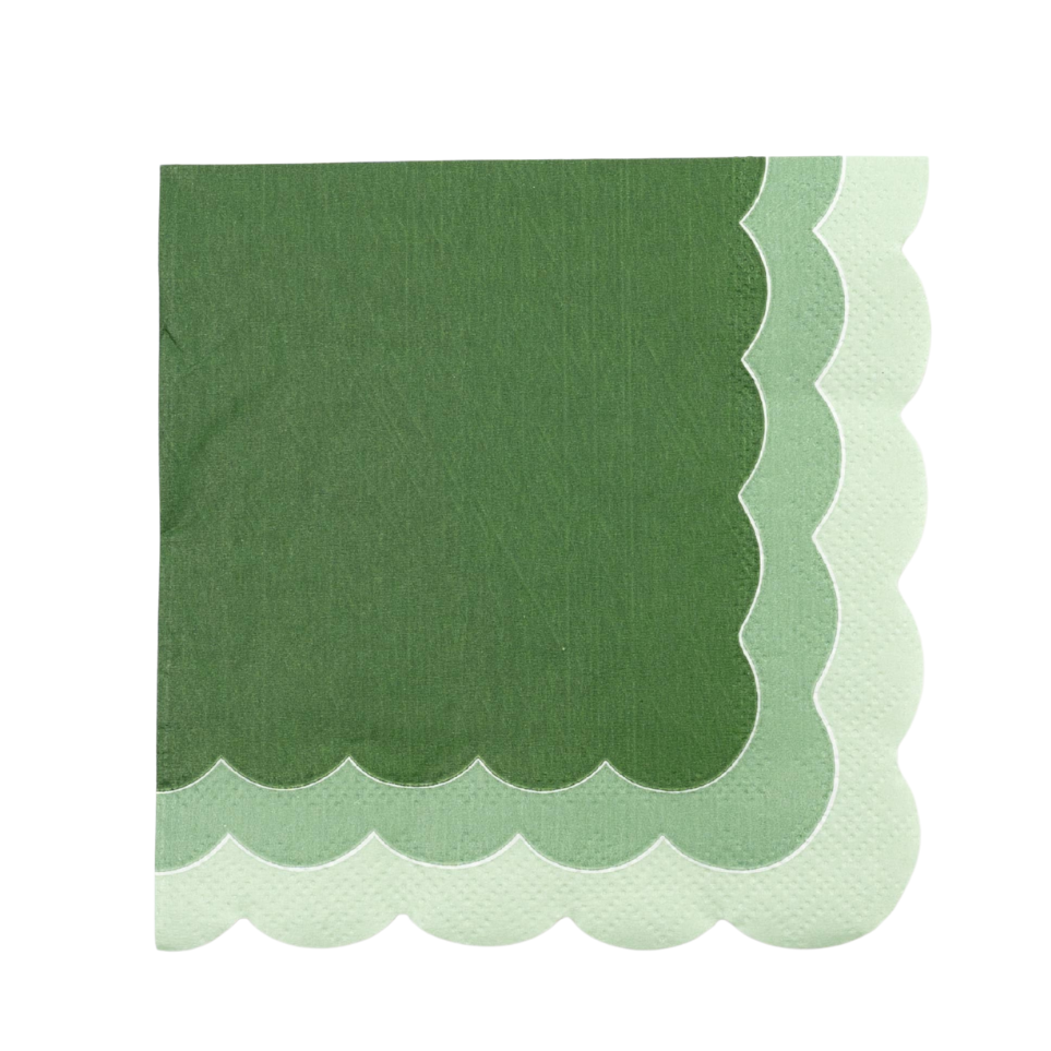 Green scalloped edge napkin on a white background