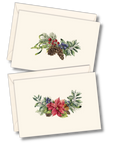 Two cream-colored greeting cards with envelopes, each featuring a watercolor botanical holiday design with green foliage, red berries, pinecones, and a pink poinsettia.
