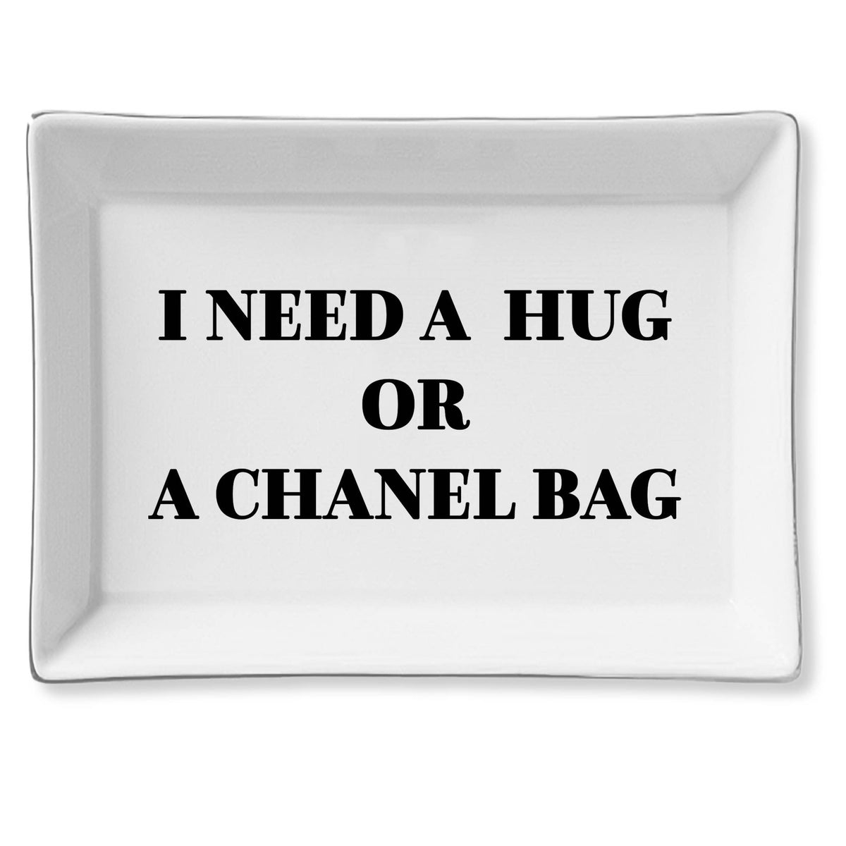 White tray with black text 'I NEED A HUG OR A CHANEL BAG' on a white background