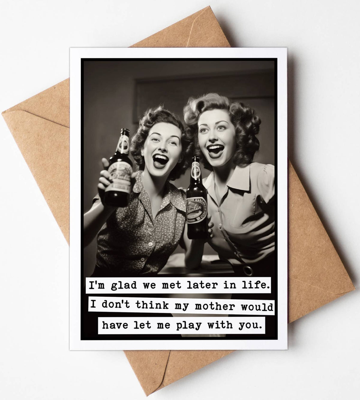 A humorous birthday card featuring two women holding drinks, with a text joke about mother's approval. The card comes with a brown envelope.