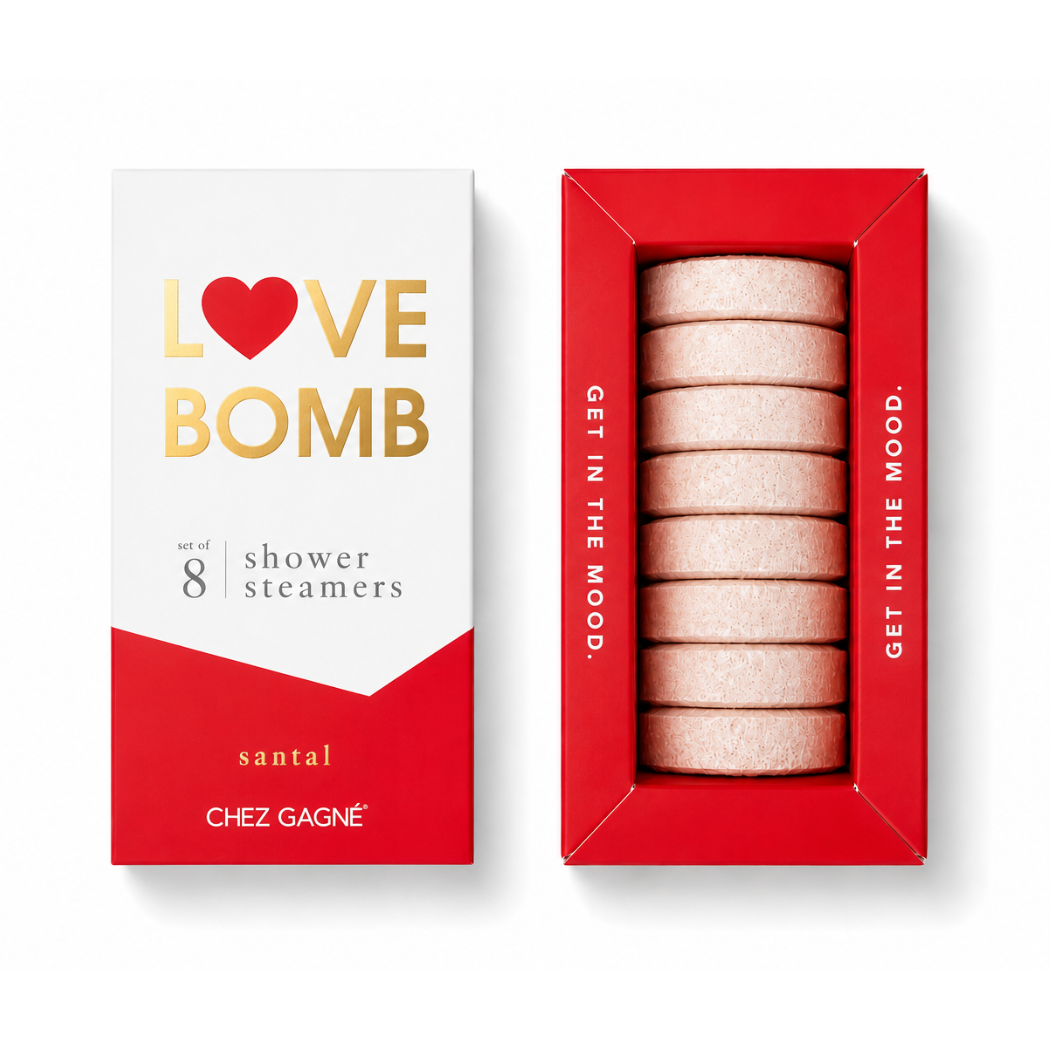 Chez Gagné 'Love Bomb' santal shower steamers set, showing the white and red outer packaging alongside the red inner tray containing eight pale pink steamers.