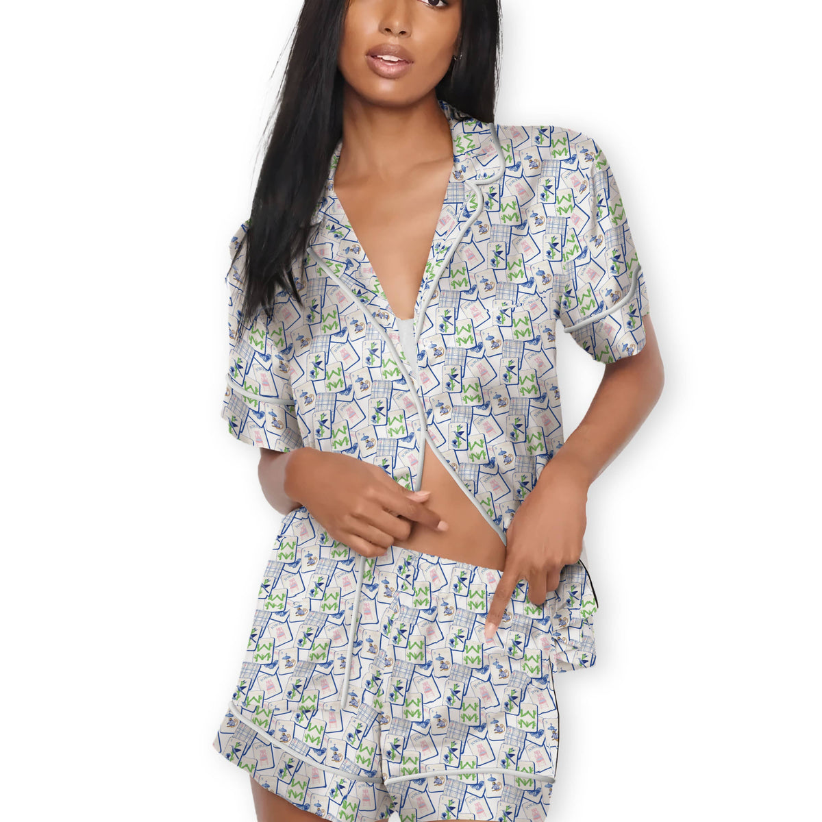 Woman wearing a patterned Mahjong  pajama set on a white background