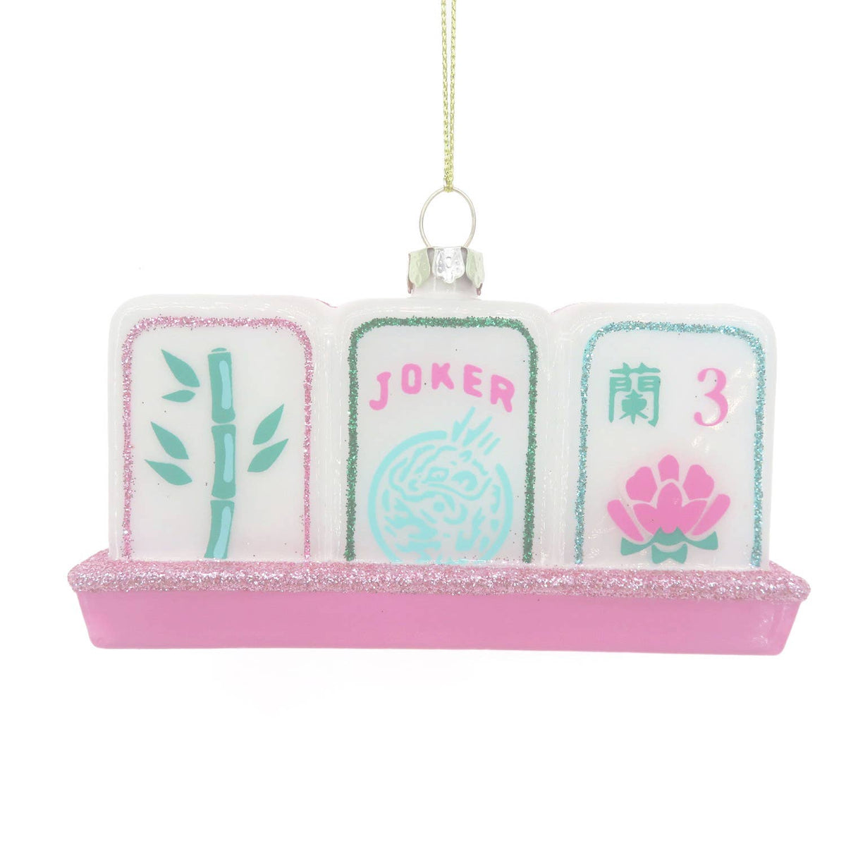 Decorative mahjong set ornament with pink base and colorful cards on a white background