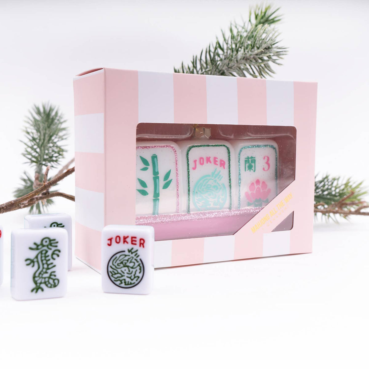 mahjong tile ornament with decorative packaging on a white background