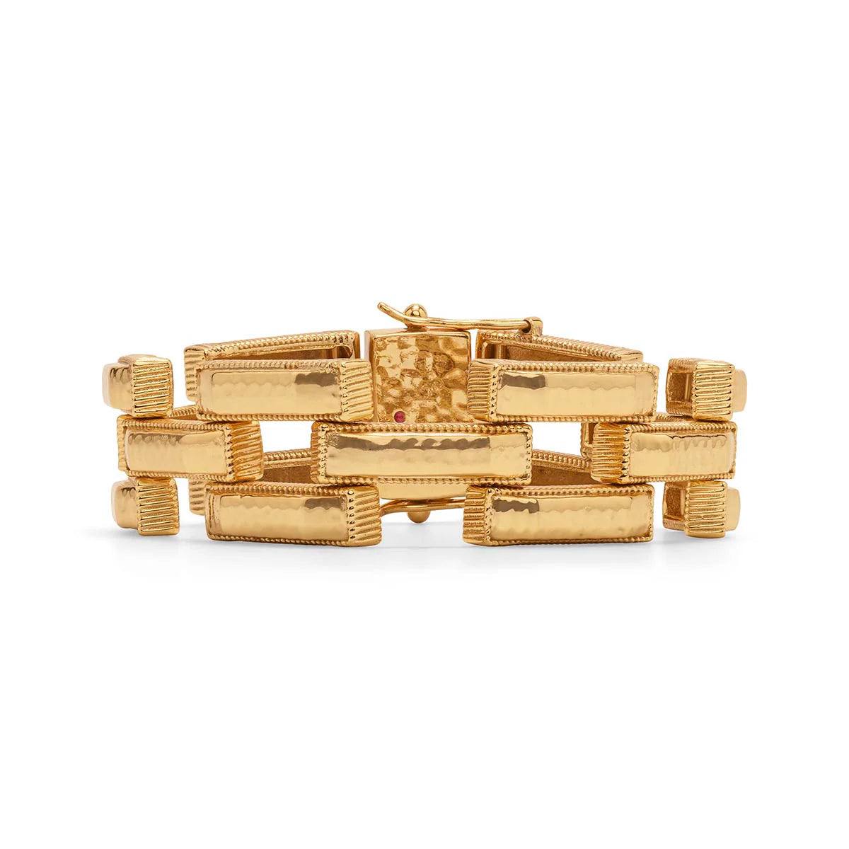 Gold bracelet with geometric design on a white background