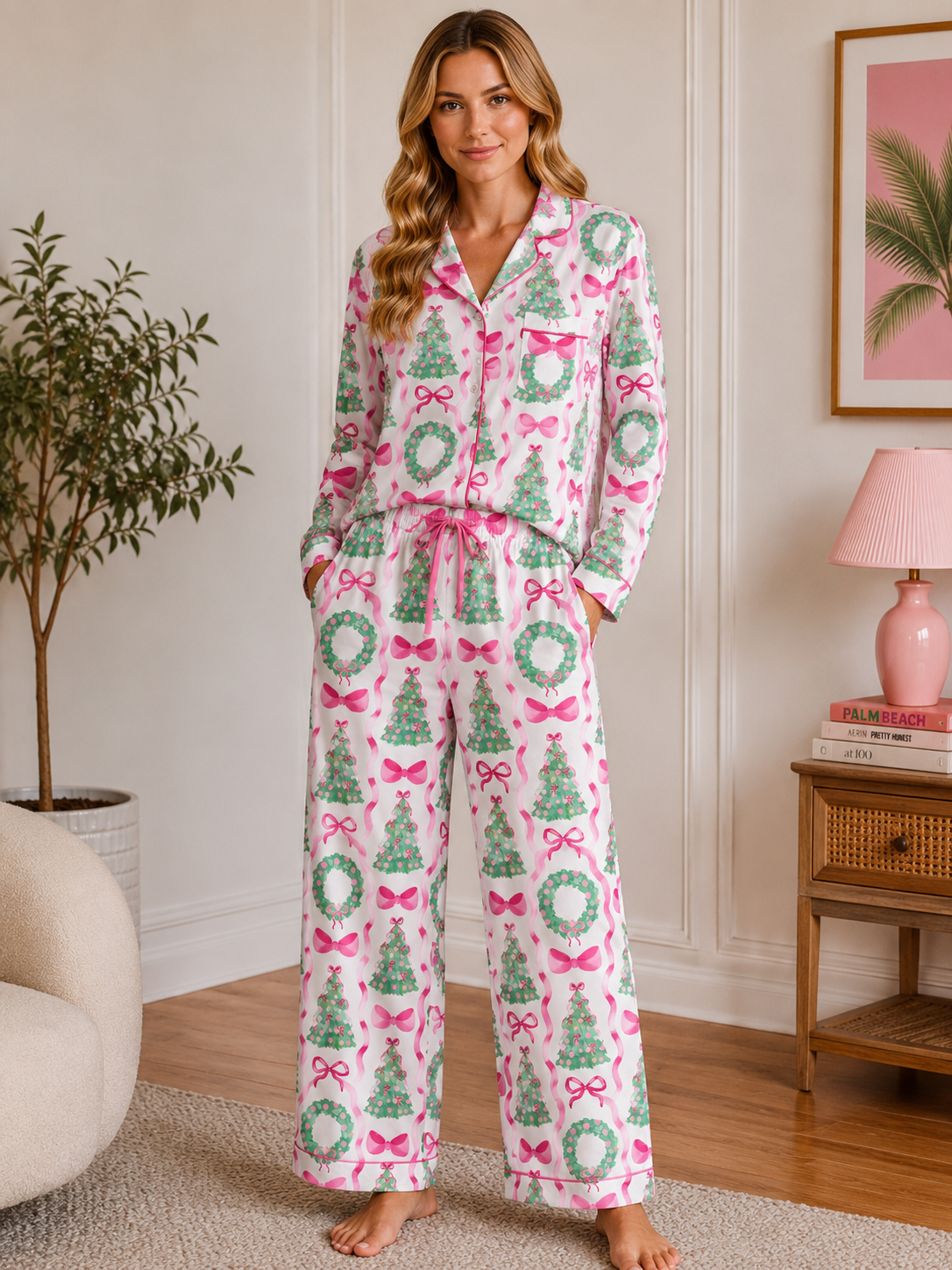 Woman wearing a festive pajama set with Christmas tree and bow pattern in a cozy room.