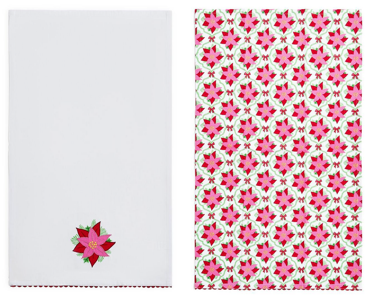 Two white dish towels shown side by side. The left napkin has a small embroidered poinsettia near the bottom.