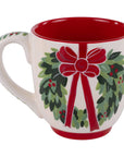 Mug with a festive design featuring a red bow and green leaves on a white background