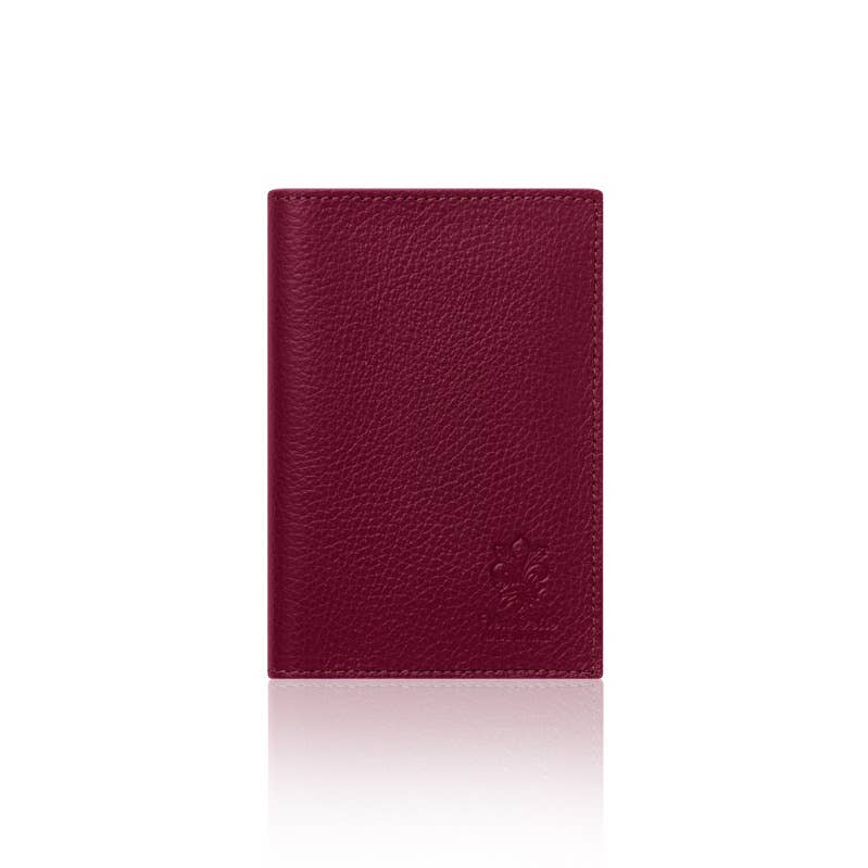 Burgundy leather red plumb leather passport cover on a white background