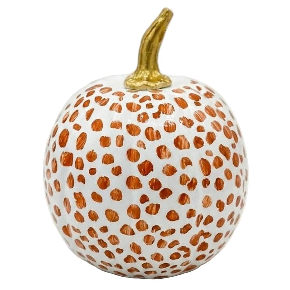 A decorative faux pumpkin with a white base, covered in hand-painted copper-brown spots, and a metallic gold stem, shown on a plain white background.